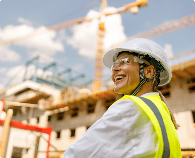 Smiling construction worker with hard hat.
